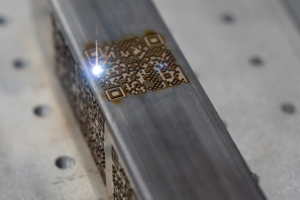 The barcode on square metal pipe from laser engraving etching machine. The laser etching machine.