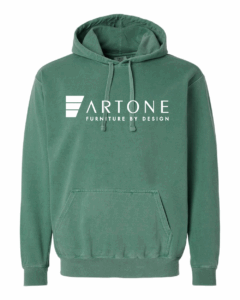 Product mockup of a light green Comfort Colors 1567 pullover hoodie featuring a large 'Artone Furniture by Design' logo on the center chest.