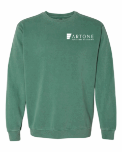 Product mockup of a light green Comfort Colors 1566 crewneck sweatshirt with the 'Artone Furniture by Design' logo printed on the left chest.