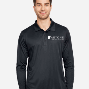 Male model smiling while wearing a custom black Team 365 long-sleeve performance polo shirt with the 'Artone Furniture by Design' logo on the left chest.