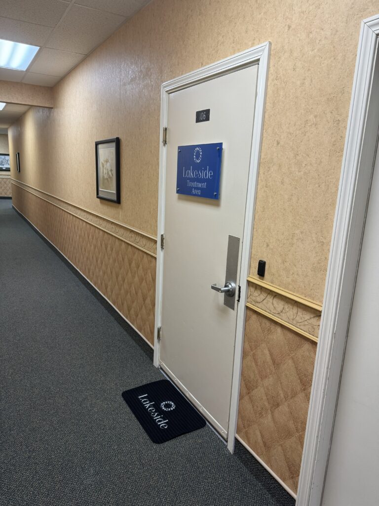 Custom Signage & Branding for Lakeside Medical Practice's New Dunkirk, NY Location: Vinyl Graphics, One-Way Window Vinyl, UV Printed Acrylic & Custom Rugs 3 Doorway to Lakeside Treatment Area